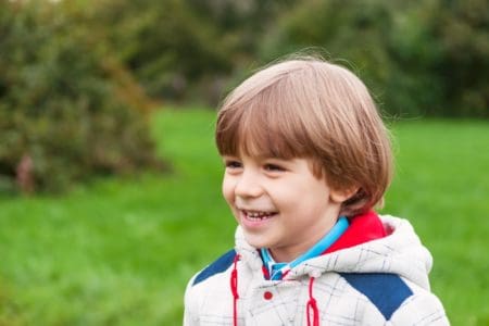 Happy little boy spending time outdoors