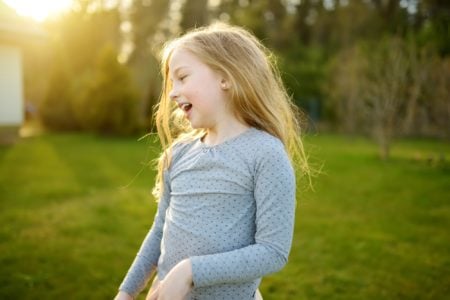 Cheerful young girl in the park