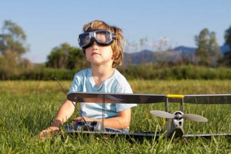 Little boy playing with rc plane