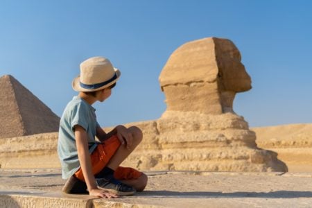 Little boy looking at the Great Sphinx of Giza