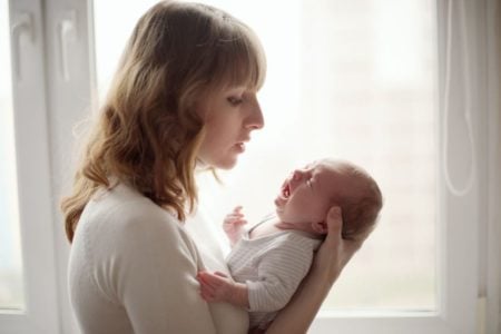 Mother comforting her crying baby