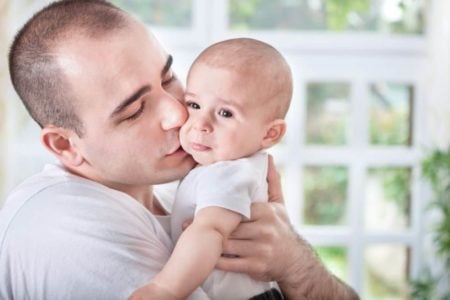 Father comforting crying baby