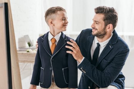 A father and a son looking at each other