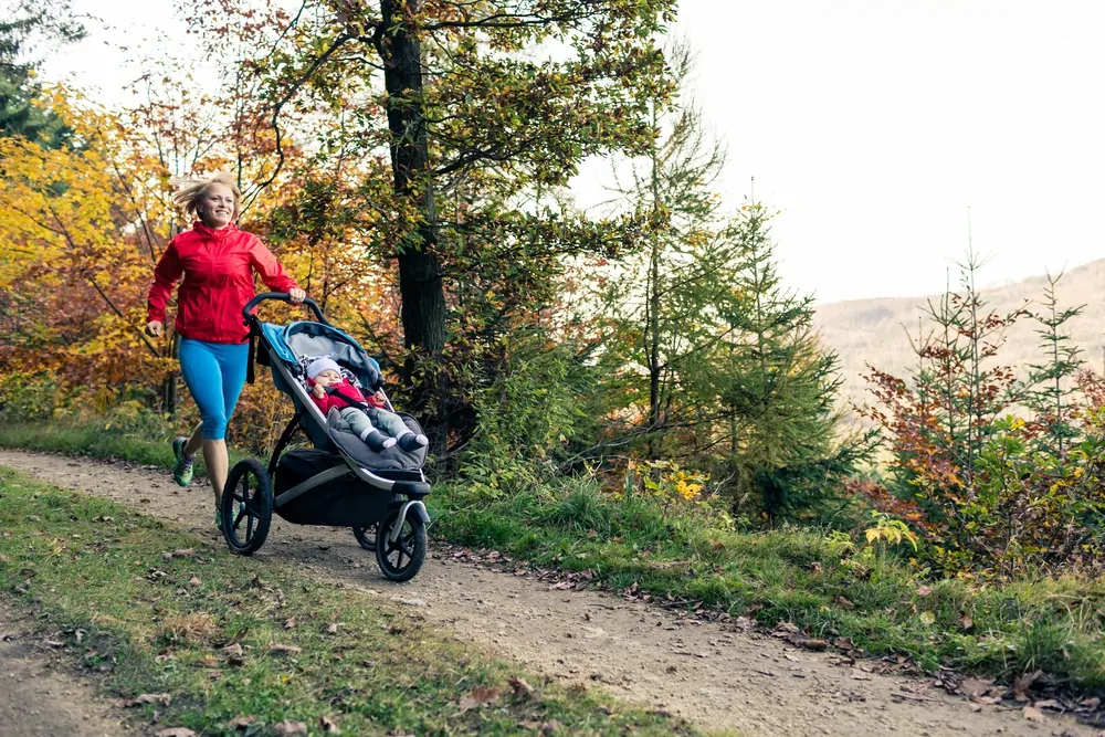 running mother with stroller