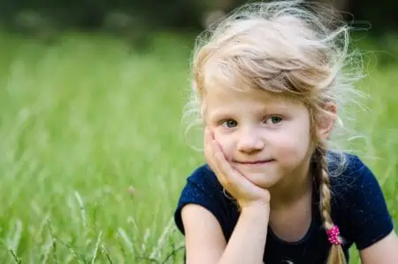 Cute little girl spending time in the park