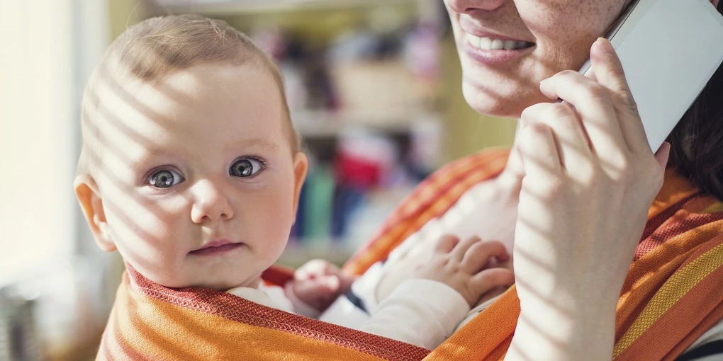 Mother wearing baby in baby carrier