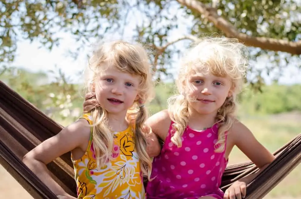 Two adorable Polish girls sitting in the hammock