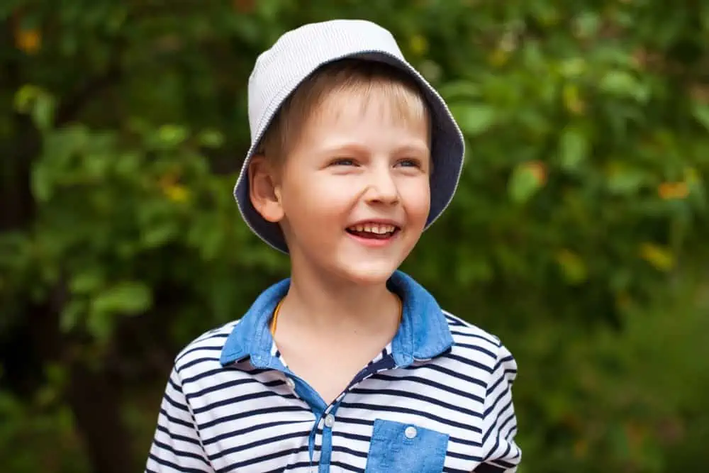 Happy little boy playing in the park